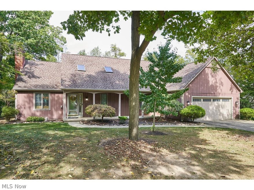 Beautifully updated 4 bed, 4 bath custom Cape Code designed by Hudson architect Jim Young.  Welcoming front porch opens to foyer flanked by the office and the dining room with fireplace.  Stunning kitchen with Kraftmaid cabinetry,  SS appliances, center island and granite countertops.  Beamed family room perfect for family gatherings.  Red Oak hardwood floors throughout most of the first floor.  Convenient first floor office and laundry room.  First floor master suite with walk-in closet and bath with dual vessel sinks and private shower.  Three additional bedrooms and full bath on second level.  Finished lower level includes kitchenette, theater area, half bath and possible 5th bedroom or second office. Beautiful treed lot with pool surrounded by Trex deck. Oversized 2 car garage, can hold 4 cars tandem.