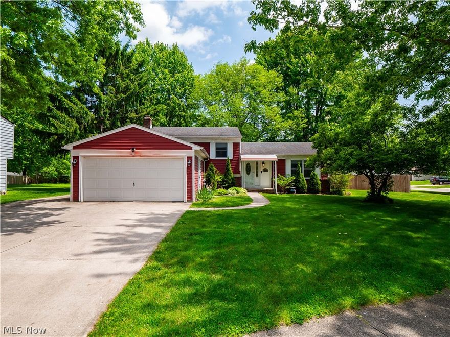 Situated on nearly a half-acre in desirable Olmsted Township, this beautifully updated split-level home offers incredible value with over 1,700 square feet, 3 bedrooms, 2 full baths, and a basement. Surrounded by mature trees and designed for both comfort and functionality, this property is the perfect place to call home. Step inside to a spacious living room that flows seamlessly into the remodeled kitchen. The kitchen features granite countertops, stainless steel appliances, stylish two-tone cabinetry, and updated luxury vinyl plank flooring for easy maintenance and everyday living. The dining area includes sliding glass doors that lead directly to the covered back patio and additional outdoor patio space that is ideal for entertaining or relaxing outdoors. Upstairs, there are generously sized bedrooms, including a primary suite with a large walk-in closet. The remodeled full bath on this level showcases updated fixtures and a granite vanity for a modern touch. The lower-level family room provides the perfect casual gathering space with a cozy wood burning fireplace and plenty of room to spread out. A second fully remodeled bathroom with a stylish tiled shower adds convenience. Completing the home is an unfinished basement offering abundant storage space. Outside, the oversized shed is a standout feature, complete with a garage door, man door, and electric, making it the perfect space for landscaping equipment, hobbies, storage, or workshop needs. Additional updates include a roof replacement in 2014, and all appliances remain, including the washer and dryer. This home is a great combination of space, updates, outdoor living, and value in a peaceful setting. Come see today!