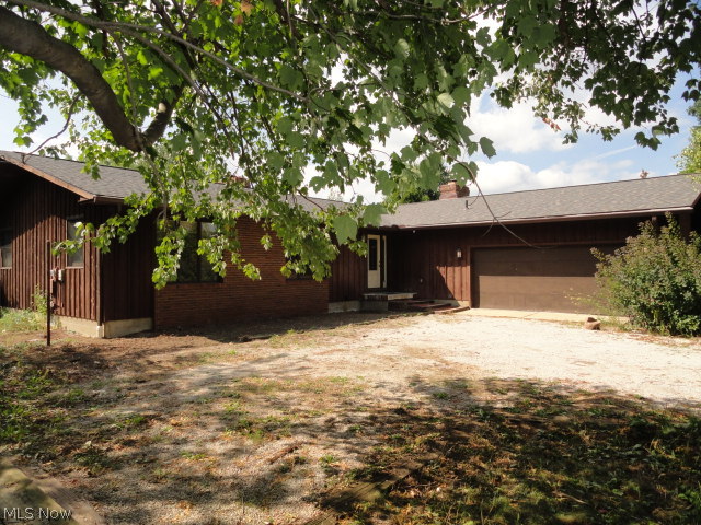 Sprawling cedar L shaped ranch in excellent condition situated on 2 acres! Yard and landscaping needs some TLC but home is solid with several updates. Spacious formal living and dining with built in shelves, wood floors, and fireplace. Nicely updated kitchen with cherry stained cabinets, stainless stove and microwave. Cozy family room with fireplace and French doors to huge deck porch. 3 spacious bedrooms, large master bath, and nicely updated guest bath. Huge basement with finished rooms. New roof in 2012. Newer softener too. Great property is flat and open with plenty of sunshine for your garden.