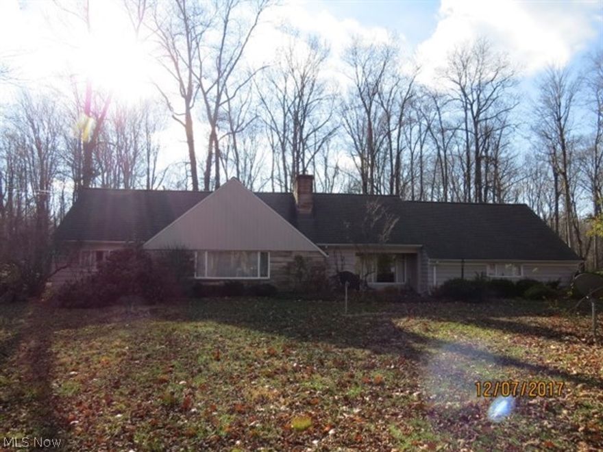 Home is situated on gorgeous 1.7 acre lot in Moreland Hills.  Spacious rooms throughout, bring your finishing touches.  Enclosed porch area.  2 car attached garage.  Orange schools.