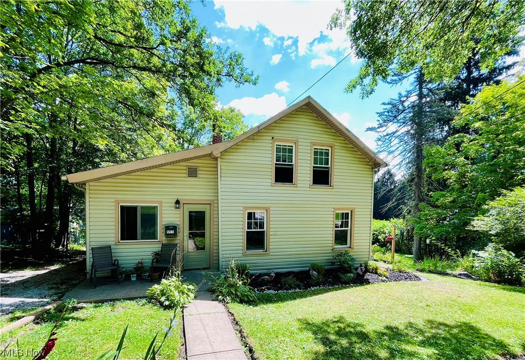 Here it is! The gem in the Village you've been looking for. Just a few blocks from Chardon Square, this charming bungalow with many updates sits atop an idyllic sloping half-acre lot! A true double lot in the village is rare. Gardens and stone, and stepping paths are an established template for you to refine your landscape hobby, grow your gardens, and enjoy this lovely space. Welcoming front porch is cute and cozy. Spacious living room and dining make entertaining easy. Large refreshed kitchen has new drywall, tile backsplash, newer appliances, lighting, new large windows to bring in the morning sun, AND French doors to the rebuilt deck overlooking the beautiful backyard. First floor primary bedroom and laundry. Upstairs, two more bedrooms and a flexible loft space. Many project updates since purchasing in 2020. Property also has additional off-street parking to the south of the home - an enormous convenience. Walk-out basement is great for storage solution and access. So much potent