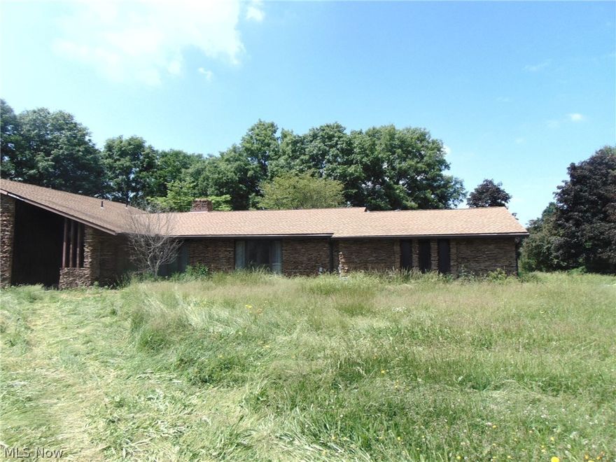 Beautiful mid-century modern home property offers two ponds, in-ground pool, huge outbuilding.  Four beds, four baths.  Needs extensive repairs.
