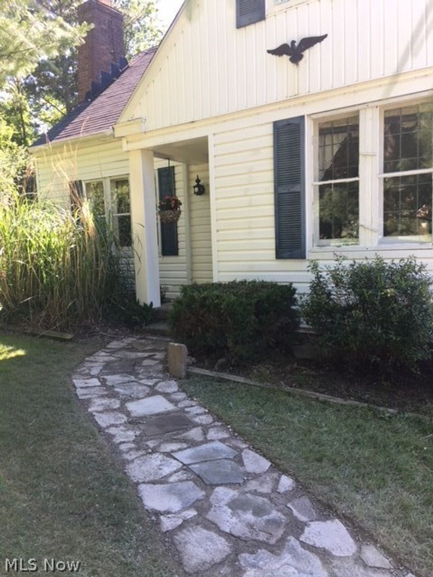 You want privacy?  Easy access to go places?  Great location?  Plus a nice home with fabulous deck to entertain?  This is it !!   and.....priced to sell !!!
Well kept bungalow has a Sun Room with it's own small deck/porch off of it.  Private from the road.   There also is a huge deck off the kitchen/dining
area through sliders (Pella!).  Great area for entertaining or just relaxing.  Extremely private - convenient for cook outs!   Inside the home there are wood
floors in the living room, dining and kitchen areas.  The living room has a corner built it as well as a wood burner in the fireplace (yes, winter will come
back).  There is a first floor bedroom which could serve as a master bedroom and a full bath.  Half way going up is a access door (very convenient)
for lots of attic storage.  Upstairs features two bedrooms (one currently the master) and a full bath (double wide shower stall).  The extra nook area
could be used for many things - small bedroom, crafting, office etc etc.