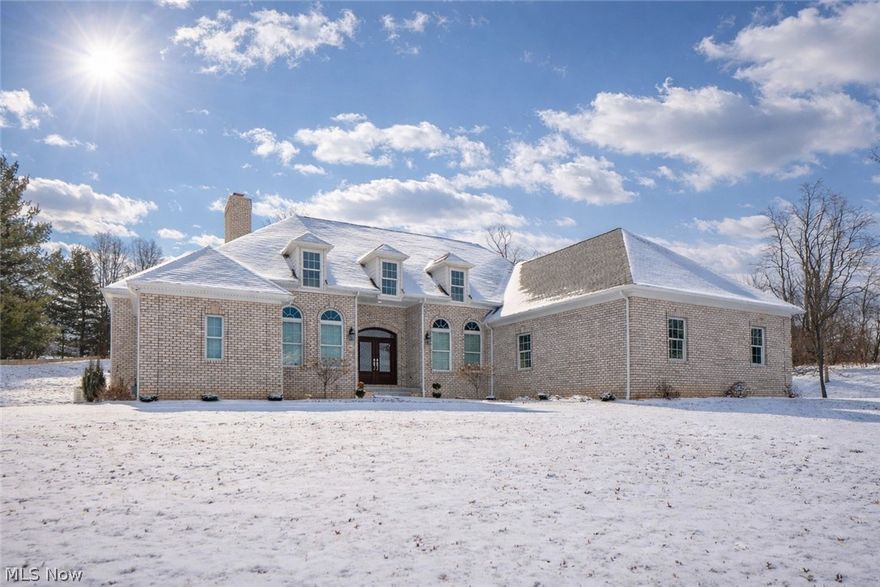 Custom-built all-brick ranch situated on a private 1.41-acre tree-lined lot in a prime Jackson Township location. Set well back from the road, this home offers a circular driveway and a peaceful backyard setting. Built in 2019, this thoughtfully designed 3-bedroom, 2.5-bath home offers over 2,650 sq ft of one-level living with 12-foot ceilings, wide hallways, and wheelchair-accessible entry, creating both elegance and ease of living. The welcoming foyer opens to a spacious great room featuring a wood-burning fireplace with gas starter, big windows providing abundant natural light. The open-concept kitchen is a showstopper, complete with high-end cabinetry with soft-close and full-extension drawers, granite countertops, tile backsplash and a large center island with cooktop and range hood. Top of the line stainless steel appliances. A breakfast bar flows seamlessly into the expansive dinette area, perfect for entertaining. The primary suite is generously sized with tray ceilings, a large walk-in closet with pocket doors, and a spa-like bath featuring a double vanity, jetted soaking tub, and an upgraded tiled walk-in shower with rain shower heads. Bedrooms two and three offer ample closet space and share a Jack-and-Jill full bath. Additional main-level features include a formal dining room, first-floor office, convenient main-floor laundry with utility sink and cabinetry, updated powder room, even a central vacuum in the basement. The heated 4-car oversized garage offers deep bays, large doors, and hot/cold water hookups—ideal for hobbyists or extra storage. The full 13-course basement provides endless potential, already plumbed for an additional full bath. A whole-house Generac generator adds peace of mind. A rare opportunity to own a meticulously maintained, high-quality ranch on acreage in Jackson Township—this home truly has it all. Call now!