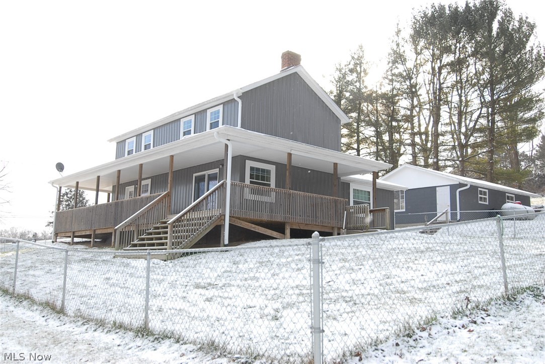 Great property for commuters (Newark/Columbus/Zanesville). Easy access to Interstate 70. Two story Colonial home sits on 3.96 ac m/l. Huge chain link fence. Completely remodeled 2016 including a large Great Room, kitchen and basement (new under addition), furnace, central air, windows, doors, paint, kitchen cabinets, countertops, drywall, large pantry and plenty of closets. 3 bedroom, 2 full baths, 2.5 car garage. Walk-out basement. Wrap around covered porch. Appliances stay.