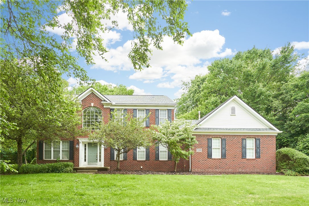 Welcome to this beautiful Colonial-style home in the highly sought-after High Hampton development. Nestled on a private, wooded half-acre lot, this home offers the perfect blend of charm, space, and modern updates. Featuring 4 bedrooms, 2.5 baths, this home is built for comfortable living and entertaining. Step inside to find a spacious Great Room with soaring ceilings, a cozy fireplace, and an abundance of natural light. The nearby kitchen is a chef’s dream with quartz countertops, stainless steel appliances, a large center island, and ample storage. Just off the kitchen, the inviting four-season sunroom leads directly to the private deck that overlooks a beautifully landscaped backyard with a stone patio and fire pit (installed 2019)—ideal for gatherings or quiet evenings outdoors. The main level also includes a formal dining room, a living room, a convenient first-floor laundry with access to the two-car garage, and a half bath. The staircase to the upper level is accessible from both the kitchen and the foyer. Upstairs, the spacious primary suite features vaulted ceilings and a luxurious en suite bath complete with a soaking tub, walk-in shower, his-and-hers vanities, and a walk-in closet. Three additional bedrooms share a full bathroom with new flooring installed in 2024. The finished lower level offers a large rec room, a closed-off area perfect for a home office, and two utility/storage rooms.Notable Updates and Features include: New 1st-floor flooring (2024), New 2nd-floor bathroom flooring (2024), Interlock switch and 50 Amp backup generator inlet box (2023), Overhead garage storage system (2023), New hot water tank (2022), New storm drain installed (2022), Basement egress window (2020), Radon mitigation system (2018), and a New roof (2017). Located just minutes from the Cuyahoga Valley National Park and the Portage Crossing shopping district, this home has it all—space, style, and location. Don't miss this opportunity. Schedule a showing today.