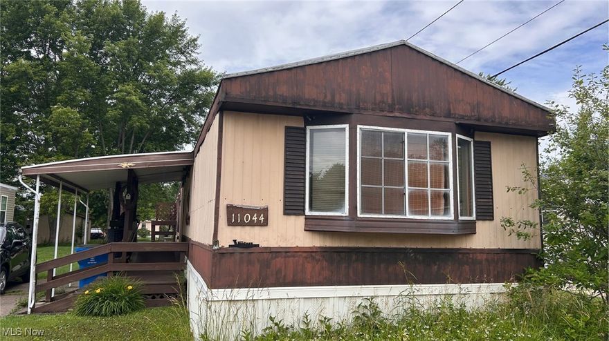 Located on quiet and scenic Leader Road, this 2-bedroom, 2-bath single-wide offers affordable living in the heart of Chardon. Inside, you’ll find a functional layout with a spacious living area, eat-in kitchen, and in-unit laundry. The primary suite includes a private bath, while a second full bath and additional bedroom provide space for guests, storage, or a home office.

Step outside to enjoy a covered front porch, a wooden storage shed, and a peaceful setting just minutes from Chardon Square, local shops, and parks. Water is provided by the park! Whether you're looking for a place to downsize, invest, or make your own, 11044 Leader Rd is a great opportunity at a great price.