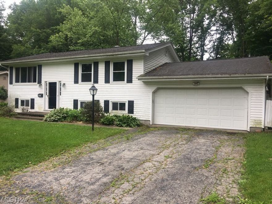 Spacious bi-level, upper level has living room, dining room, kitchen, 3 bedrooms and a full bath.  Lower level can be used as a separate living suite or entertainment area as it has a large family room with a kitchen, 4th bedroom, full bath and a large utility/laundry room filled with storage cupboards and a walk thru to the 2 car attached garage.