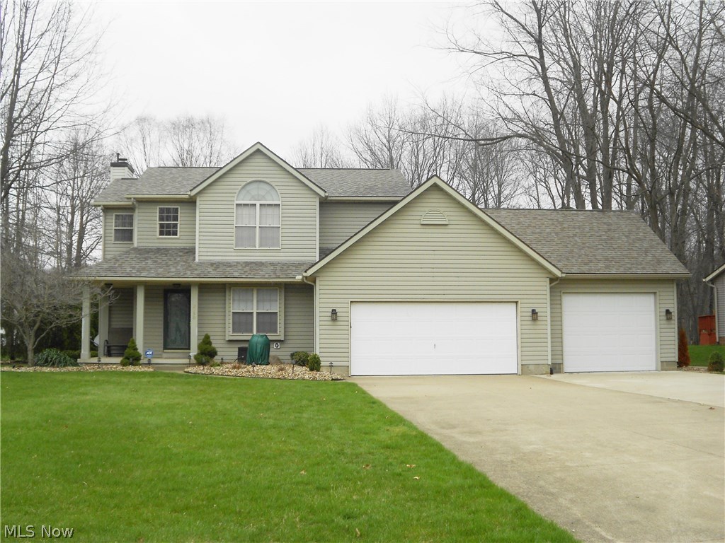 A definite beauty! Welcome to this 3 bedroom, 2.5 bath contemporary home with hardwood flooring in the foyer and hallway. The great room offer a gas fireplace and opens to the updated kitchen with granite counters and granite sink, tiled backsplash, stainless steel refrigerator and stove, newer fixtures and flooring, plus a nice size pantry. Sliders from the kitchen lead to the 3 season sun room (12 X 14) with 2 sets of sliders for easy access to the deck. The backyard is truly amazing, in addition to the deck it features a gas fire pit, gazebo and shed making it a great entertainment area. A formal dining room and laundry room with closets and cabinets complete the first floor. Upstairs you'll find a master suite with a 7 X 7 walk-in closet with custom built organizers and a full bath offering a double sink vanity, walk-in shower and soaking tub. The home comes with drywall if you choose to finish the basement for additional living space. The heated 3 car garage features pull