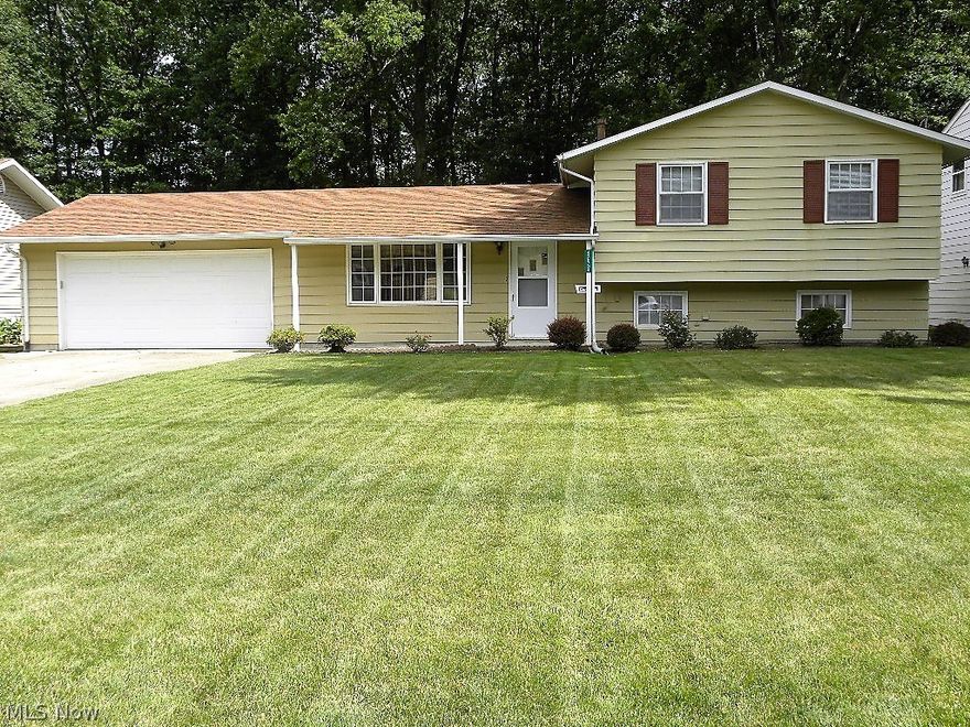 Pride of ownership shows throughout this well maintained split level home.  Located in Elyria Township, no rita taxes!  This home has 2 parcels which equal over 3/4 of an acre. (.87 acre) First floor features spacious living room, kitchen with eating area that has a sliding glass door that opens to the patio. All appliances stay with the home, including the washer and dryer. The lower level is finished with a large family room, laundry room and a full bath with shower stall.  Upstairs you will find 3 bedrooms and a full bath.  There are hardwood floors under the carpeting in all the bedrooms and the living room.  You will be impressed with the attached 2 car garage, that has an attached 22x20 workshop with a garage door and separate man door to enter into through the garage.  Perfect for woodworking, auto tinkering, storage of your extra vehicle, a hang out for your kids, the possibilities are endless...there is also heat in that area.  The roof is approximately 5-6 yrs old. Kitchen an