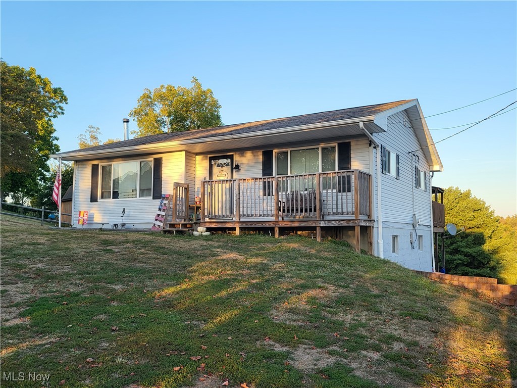 Looking for the home that is your peace and respite from the day to day? Look no further. Whether you sit out on the front porch and enjoy the sunset and view, or the large back deck (freshly painted), enjoying the view of the hills and valleys of our wonderful area, you will enjoy the quiet and serenity of this homes location. This home has been remodeled with easier living in mind. This ranch home features 2 bedroooms and a full bathroom on the main living area, then go downstairs and find a large finished bedroom with access to the back yard, corrugated tin ceiling, finished bathroom and an additional finished space you can use for an office, bar, or even consider it a captured bedroom if you need a fourth bedroom. There is still plenty of room leftover in the basement that is your laundry room, separate room for the hot water tank and furnace, and another room that holds your backup heat wood burner. Plenty of storage and closet space. This house has everything, except you! See it before it is too late! 24-48 Hour advanced showing request required.
Comes with 2 year home warranty!