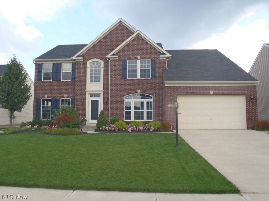 Only 6 years young! Why build when you can buy this beautiful, full brick front, 4 bedroom, 3 bath colonial with tons of upgrades in desirable Sandstone Ridge! Gourmet eat in kitchen with granite countertops, large island, 42" cabinets, double oven, cooktop, and wood flooring. Morning room with beautiful wood floors and French doors leading out to large paver patio with seat walls, lighting, and built in fire pit. Great room with 4ft extension and gas fireplace. Formal dining room with chair rail, tray ceiling, and bay window. First floor office with French doors. Large owner's suite with tray ceiling and a 12x11 sitting room, 2 walk in closets, full bath with double sinks, ceramic tile, stand up shower, and garden soaking tub. 96% high efficiency furnace, dual zone. Upgraded plumbing. ADT security system. Paver walkway. Garden area with built in irrigation. Sprinkler system. 1 year HMS home warranty. Close to 100K in upgraded options. Don't miss out!