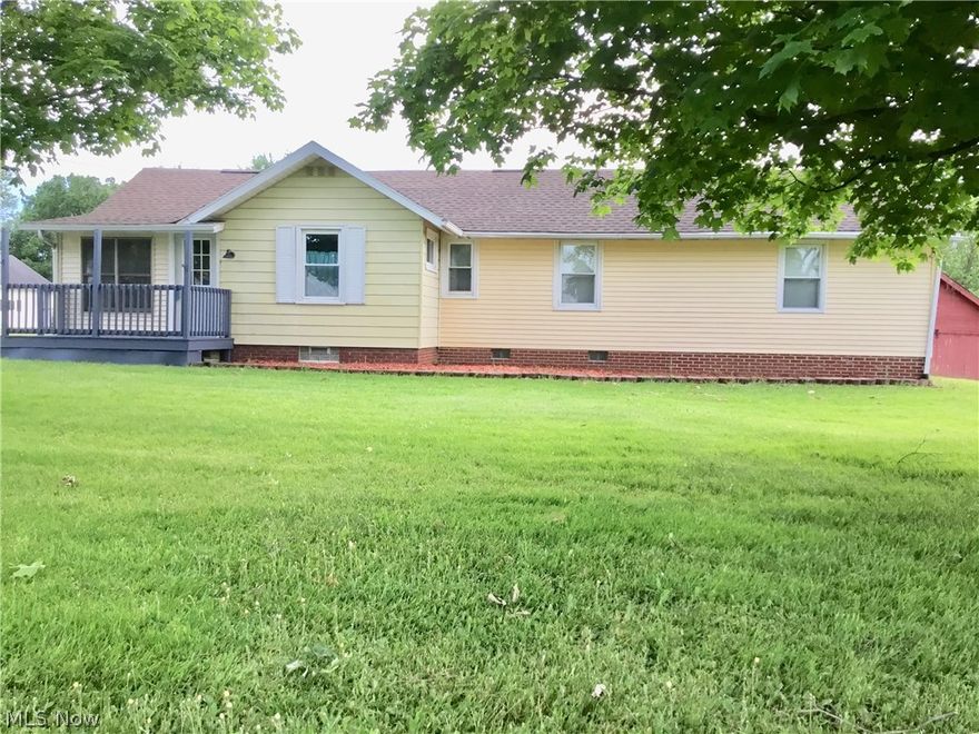 A great home with lots of room to grow, both inside and out. This 3 bedroom ranch sits on 1.2980 acres of land on the edge of Columbiana County. The ceramic tiled entry way leads into a newly refinished living room with a vaulted ceiling and arched picture window.  The master bedroom has a full bath as well as a spacious walk in closet.  New Kraftmaid cabinets have been installed in the kitchen.  There are full length closets in both the smaller bedrooms as well as a full length closet in the mail hall.  All of the rooms have been repainted.  The basement contains a partially finished 26 x 14.5 family room with fireplace and outside access that has limitless possibilities.  Breezeway and Carport in rear of house.  Roof  2012.  Furnace and electric November 2017. Seller providing Home Warranty. Well and septic inspections are done and have passed.