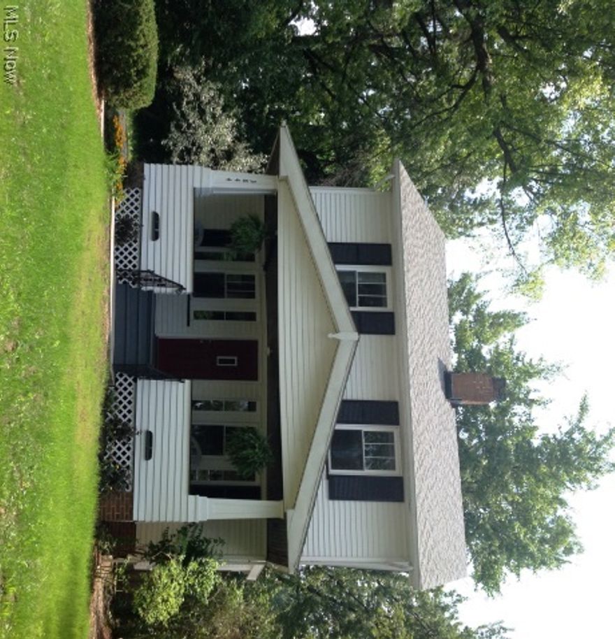 This charming craftsman style colonial has been completely renovated from top to bottom. Updates in 2014 include: new windows, furnace, H20, maple kitchen cabinets and counters, ceramic flooring, all new appliances, gleaming hardwood floors. Electric and plumbing have been updated and the lower level features glass block windows and a 1/2 bath. The living room features a beautiful wood burning fireplace which can be converted to gas and refinished original hardwood floors. The sunlit dining room boasts original built-ins with leaded glass windows and a new 15 lite door. Enjoy a BBQ on your new deck off the dining room. Three good sized bedroom with hardwood floors and walk-in closets are found on the 2nd floor along with a completely remodeled large bathroom with ceramic floors and a tub/shower surround. The home has a new waterproofing system with a lifetime warranty. Sit back and relax on the large front porch and enjoy the parklike views. This home is minutes to downtown, University