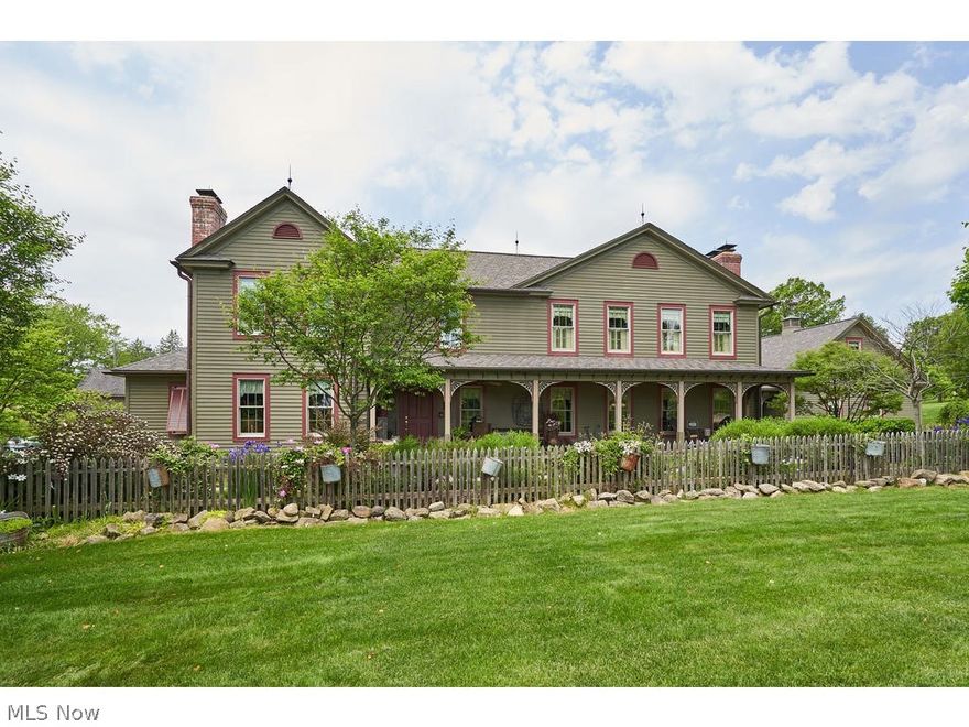 An extremely rare opportunity to own Copley's premier historical farmhouse. The home, which is directly across the street from the Winery at Wolf Creek was completely and exquisitely restored in the late 1990s as the "Whimsical Pig Bed and Breakfast at Wolf Creek." This 5 BD, 3.5 BA farmhouse experience on 1.12 acres features 4,690 sq ft of living space, aged golden hue pine flooring throughout, and a warm, inviting feeling inside and out. The kitchen is the center of the home & features Soapstone countertops, Viking stainless steel appliances, walk-in pantry, breakfast room, & doors leading to breathtaking back yard, complete w/multiple stone patios, lush grounds, Koi pond, & hot tub. Impeccable landscape w/several perennial gardens throughout property. Family room is off of the kitchen and features a beautiful stone fireplace and French doors overlooking the backyard. Office, dining room,  library/ study, laundry, and 2 half baths complete the first floor. 2nd floor features master s