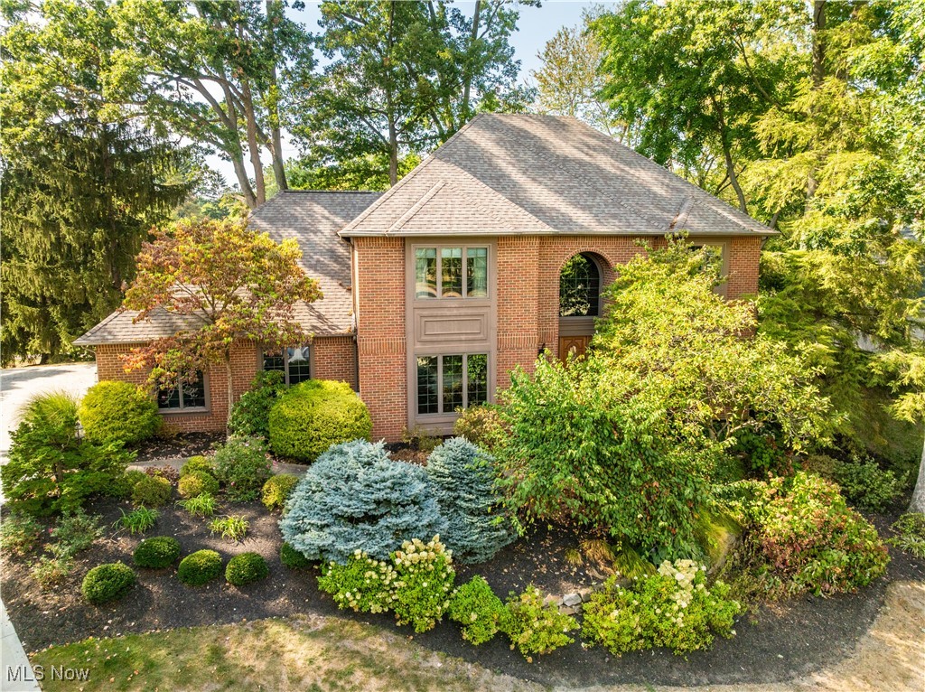 Luxury Living in the highly sought-after Glenmoor Estates, situated on the Jack Nicklaus Signature Golf Course. Tucked along the prestigious Jack Nicklaus Signature Golf Course with an enviable view of the water feature on hole #7, this exquisite brick residence offers four spacious bedrooms, 3.5 bathrooms, and a mostly finished lower level. From the entry, step into the foyer with your office/den to your left and your living room to your right. Off the living room is the dining room with easy access to the kitchen. In the Florida room, you'll find newer carpet, and French doors lead to a deck and gazebo, the perfect spot to enjoy the serene views of the fountain. The great room, enhanced by skylights, a wet bar, a gas fireplace, and views of the course, flows seamlessly into the kitchen, which features wood cabinetry, Corian countertops, a tile backsplash, a pantry, and an eat-in area. Completing the main floor are the laundry room and the 1/2 bath. Upstairs, the primary suite features dual walk-in closets and a luxurious, spa-like bathroom, complete with a soaking tub, glass-enclosed shower, dual vanities with granite countertops, and exterior access to the balcony. Three additional bedrooms and a full bath complete the upper level. The lower level is an entertainer's dream, complete with a full bar featuring granite counters and a stained-glass wine cellar. A spacious rec room with a gas fireplace, multiple bonus rooms, and an updated full bath with a sauna add to the luxurious amenities. The exterior features include a 3-car attached garage and a back deck with a gazebo overlooking the course, which provides views of the fountain. Plus, you are not too far from Belden Village and highways. Don't miss your chance to see this beautiful home; schedule your showing today!