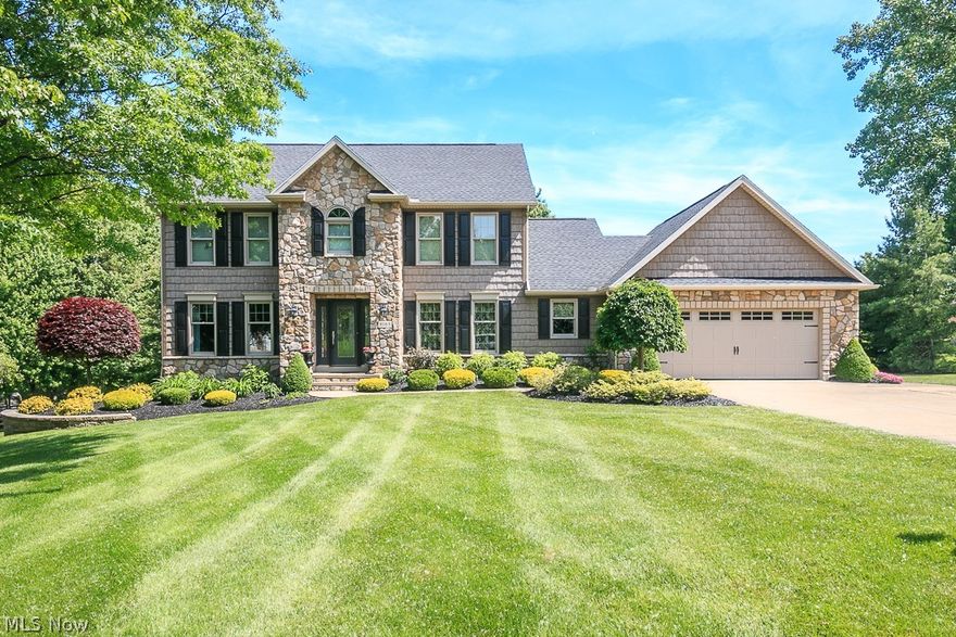 Welcome home to this stunning 4 bedroom, 2.5 bath colonial in Concord. Remodeled kitchen with granite countertops, upscale custom cabinets and all upgraded stainless steel appliances. Family room features gas fireplace which has been refaced with stone and custom designed built-ins. Crown molding and arched doorways throughout. Custom wrought iron banister that adds character. Bluetooth speaker system throughout first floor- perfect for entertaining! Spacious master suite with plenty of closet space and a full bath. 3 more large bedrooms upstairs and another updated full bathroom. If that isn't enough space there is a huge finished walkout lower level with newer carpet. Custom stone exterior and vinyl shaker accents, landscape lighting, an irrigation system and raised gardens. Enjoy your backyard oasis featuring a two tiered low-maintenance composite deck that is perfect for entertaining, a storage shed and a patio leading off of the walk-out basement! 2 car attached heated garage with