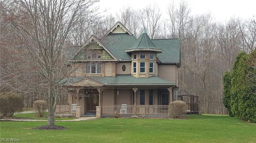 Step back into time with this beautiful, 3,760 sq. ft. Victorian style home with attached three car garage on a two acre cul de sac. Quality Custom built home with 3 sided, wrap around front porch, 20 x 30 rear deck with wooded back lot.  Oak trim throughout plus gourmet kitchen with fireplace, exiting to sun room, and first floor laundry.  Full size dining room with new carpeting with china cupboards and window seat. Family room has fireplace with new carpet. First floor office has oak crown ceiling could be used as a bedroom. Second floor Master bedroom with spiral staircase to loft, currently used as a work out area, could be used as office or studio.  Private master bath with glamour bath and see through gas log fireplace. Full finished basement with wet bar and half bath. Finished room could be additional bedroom or office. Basement also has crawl space and walk out access to garage.  Additional laundry available in basement. Space about garage has separate access and could be eas