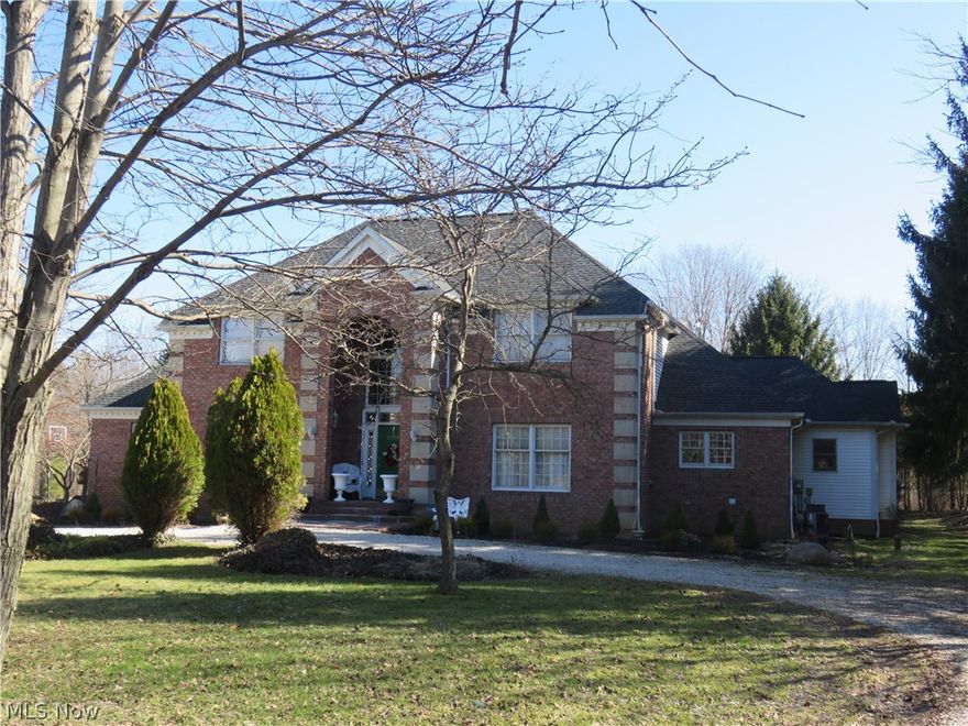 Custom built Georgian colonial on 1.15 acre secluded lot. This home offers a stunning grand oak staircase w/gorgeous spindle work, 12" crown moldings, architectural columns, hardwood floors, so much more. The first floor has formal living w/fireplace, dining, large kitchen w/eating area, step down family room w/floor to ceiling Arizona stone fireplace, built-ins too. There is a back hall leading to side entry door and 3 car garage. The kitchen has a planning area w/built-ins, large window overlooking the backyard, huge walk in pantry, newer stainless dbl wall oven and DW, cooktop island, ceramic tile floor and countertops are neutral. The owner's suite has a vaulted ceiling with French doors leading to the deck, ensuite bath, walk in closet leading to the laundry rm. The office/den w/built-ins could also be a 5th bedroom. There are 3 bedrooms up, two of those with private baths. The basement is massive and has stairs leading to the garage. Roof is newer, zoned heating, glass block bsmt