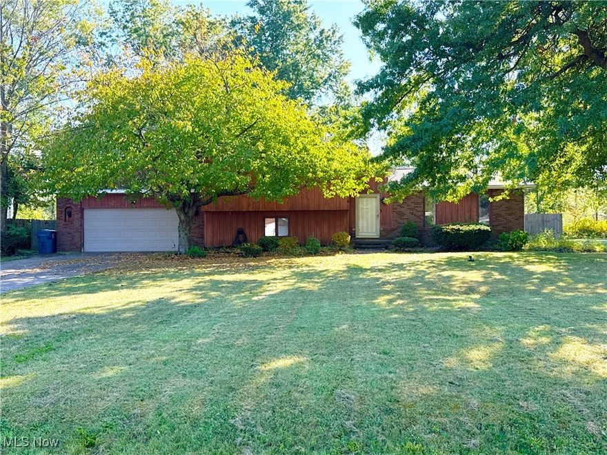 Welcome to this unique and spacious 5-bedroom, 3 full bath multi-level home located in the desirable Amherst School District! With 2,788 sq. ft. space, this property offers both comfort and versatility, perfect for today’s lifestyle.

As you approach, you’ll love the curb appeal and charm of the front exterior along with the inviting front yard. Step inside and be greeted by vaulted ceilings, recessed lighting, and updated plank flooring that flows seamlessly throughout the open living area. The kitchen features granite countertops, stainless steel appliances, a breakfast bar, and plenty of cabinet space, making it a true centerpiece of the home.

The lower level is highlighted by a cozy brick fireplace and includes a full bath, an entrance to the spacious 2-car garage, and access to the basement which offers endless possibilities for additional living or storage space. This level also provides extra finished rooms that could serve as a home office, gym, or flex space to fit your needs.

Upstairs, you’ll find two bedrooms, with one featuring a unique staircase that leads to an additional finished room—perfect as an office or even a bonus bedroom. A few steps up, the large master suite awaits, complete with a full bath and a private patio door leading to the deck.

The outdoor space is equally impressive, featuring a multi-level deck, lower-level bar area, patio with swings, and a fenced-in backyard—all situated on just under a half-acre lot.

This home truly has it all—space, updates, and character—along with the flexibility to create the lifestyle you’ve been looking for. Don’t miss the chance to make it yours!