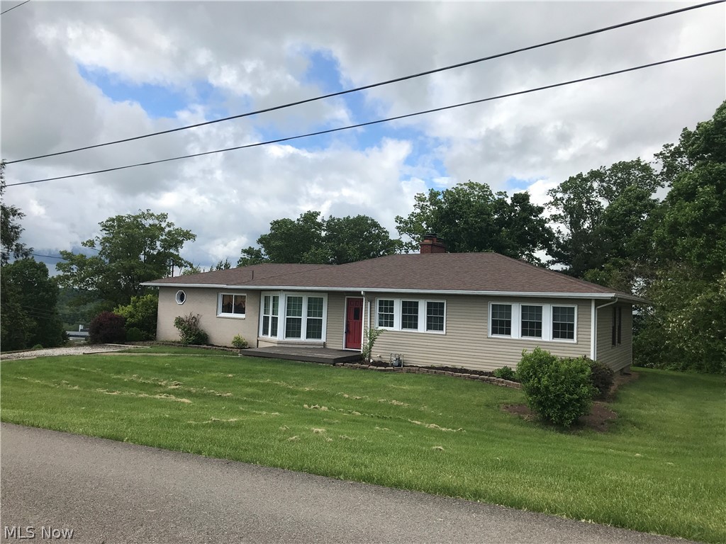 Big yard with a view of the Muskingum River through the trees. 5 bedrooms, 3 full bathrooms that has been recently updated. New carpet in the hall way and the 3 bedrooms on the main floor. New windows in the master bedroom. New door going out to the deck from the living room. Fresh paint on the back deck.
Gas fireplace in the living room and family room in the basement. Kitchenette in the basement with washer and dryer. 2 garages from the basement .
Big open kitchen and dining area, that leads to the sunroom. Sunroom has several siding doors that open up to the deck
The property is located on the West side of Marietta with a great view.