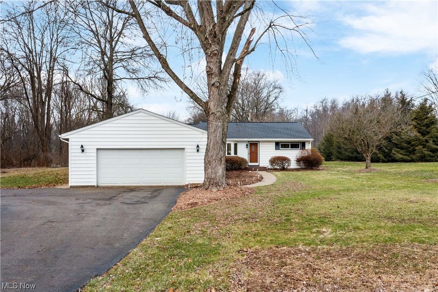 This home in Jackson Township is a hidden gem with 2.79 acres of cleared yard and woods. Vaulted ceilings with skylights, a huge living room, and a master suite oasis create the perfect 1-floor living. Walking distance to the elementary and middle schools. Enjoy a cup of coffee on the sprawling deck or next to the window in your 3-seasons room (which is really 4 seasons with heat and AC). The large kitchen is great for entertaining. The 8x12 shed has been converted into a large chicken coop. The soil in the front yard is primed for a large organic garden, and the large greenhouse is ready for Spring planting. Deer and other wildlife are frequent visitors to the apple and pear trees.
Flower beds are full of beautiful perennials and were freshly maintained and mulched in the fall.  New roof 2016, kitchen appliances 2016, A/C 2017, HWT 2018, carpet 2019, septic line w/ warranty 2021, garage door opener 2022.