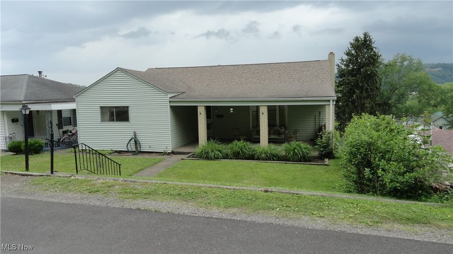 Very nice 3 bedroom ranch in town with a great view of the river and fireworks!  Built by the sellers father, it is basically a one owner property.  Hardwood floors in the large bedrooms, and per owner, hardwood under carpet in hall, living, and dining rooms.  Circular layout with large eat-in kitchen, plus a dining room.  Living room looks out to the huge covered front porch.  Deck off of kitchen had to be removed, but you can see the potential!  Terraced back yard provides 2 separate levels.  walk out basement.  Huge family room in basement with large fireplace.  Other half of basement can be finished.  Plumbing is there for another bathroom.  Large workshop to tinker in as well.  Newer roof, and updated electric.  Being sold "as-is".