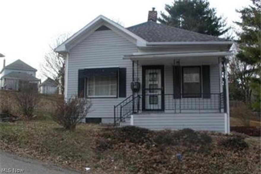 They say big things come in small packages and that is true with this home!  3 lots, corner location with off-street parking and detached garage.  Open living room and dining area with wood floors beneath existing carpet, kitchen includes appliances.  Full bath and 2 bedrooms on main floor plus a massive family room that could easily be your master bedroom.  Walk up attic for extra storage space.  The full walkout basement has finished living room with woodburner, laundry, and shop area.  Tons of space!  Sliders from basement open to side patio.  There is a partial bath in the basement. Attic, basement and walls have new insulation resulting in tremendous heat savings.  Lots of yard space too!