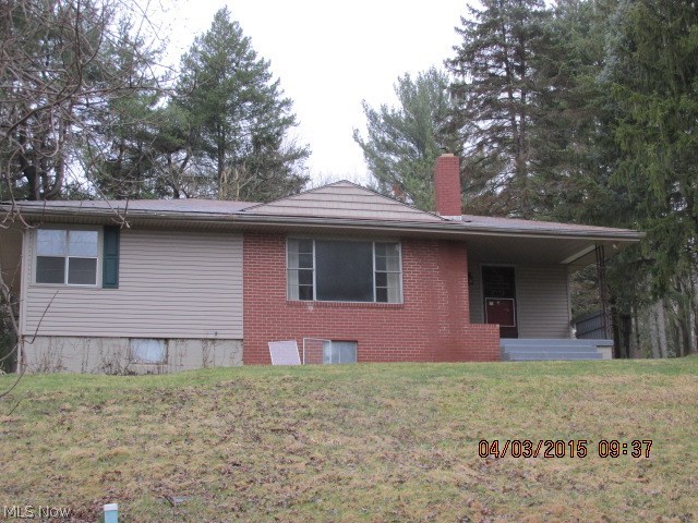 Brick and frame 1 story home with a patio in the rear. Home features a living room with brick fireplace, dining room, kitchen, 2 bedrooms and 1 bath. Full basement with a 1 car garage.