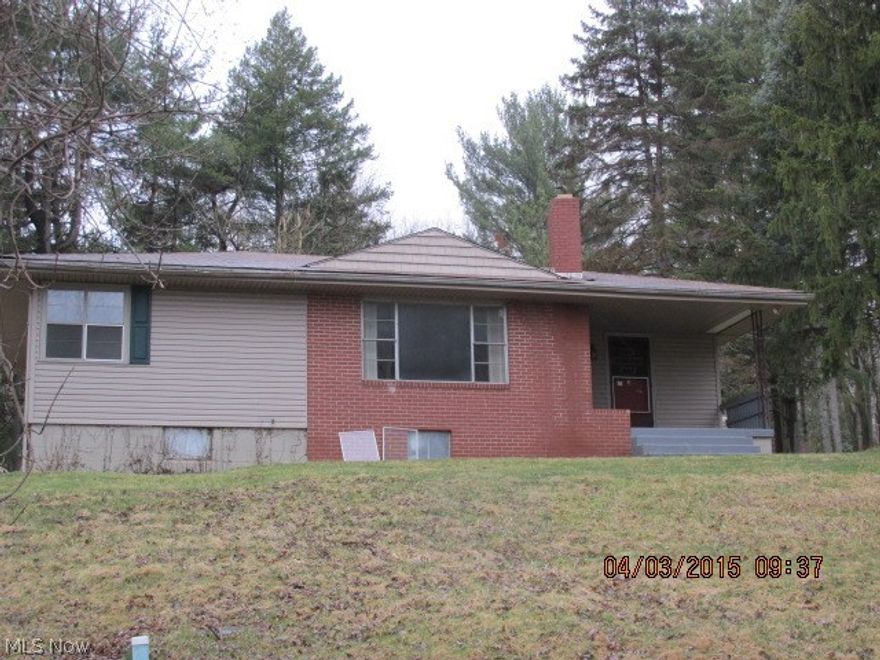 Brick and frame 1 story home with a patio in the rear. Home features a living room with brick fireplace, dining room, kitchen, 2 bedrooms and 1 bath. Full basement with a 1 car garage.