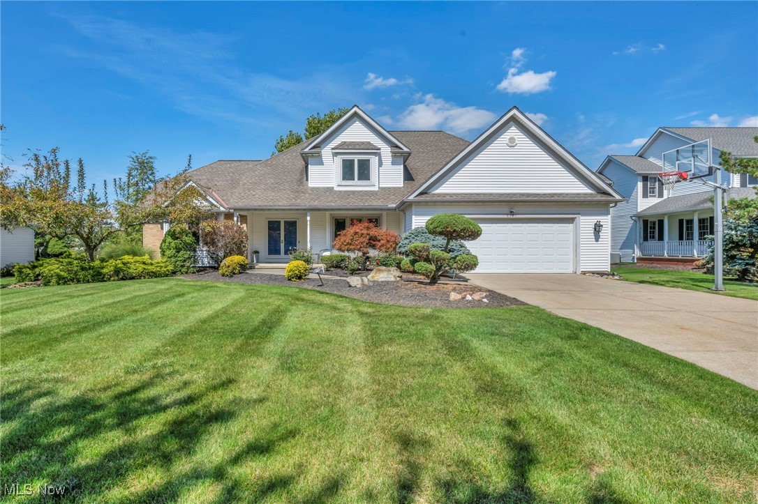 Beautifully updated home located on over .4 of an acre property in the highly sought-after Highland Woods East community in Highland Hts, featuring a 1st-floor primary suite, finished basement, front porch, deck & expansive stone patio w/ a pergola. With 4 bedrooms, 3.5 baths & over 4,894 sq ft of living space including the finished lower level, this home blends comfort, sophistication & spaces designed for gathering. A dramatic 2-story foyer w/ marble flooring leads into a great room where a wall of windows frames the backyard & natural light pours across engineered hardwood floors. A 2-sided fireplace connects the great room & dinette, creating a warm flow for everyday living or entertaining. An updated kitchen has quartz countertops, stainless steel appliances, center island w/ breakfast bar & generous dinette w/ access to the deck. A formal dining room w/ tray ceiling & wainscoting adds to the thoughtful layout. The 1st-floor owners' suite has a tray ceiling, 2 walk-in closets & en-suite glamor bath. The finished lower level expands the lifestyle options w/ flexible spaces for recreation, fitness, work, or play, complete with built-ins, wet bar & full bath. A 1st-floor laundry room & attached 2-car garage complete this exceptional home. Recent updates include: Replaced roof (approx 2013), HVAC (2020), windows (2021-22), hot water tank (approx 2020), remodeled kitchen & 1st-floor bath (2018), installed engineered hardwood floors on 1st floor (approx 2013) & 2nd floor (2022), custom window treatments throughout (2022-23), and stone patio (2021), finished basement w/ game room, full bath & office area (approx 2012), and more. INCLUDED are ALL kitchen appliances, washer/dryer, basement fridge, basement entertainment unit, TV & mount in basement office, pergola, Vivint security system & a 1-year home warranty. Conveniently located near I-271, Stonewater Golf Course, and plenty of shopping, restaurants, parks, and other local attractions. This home is a must see!