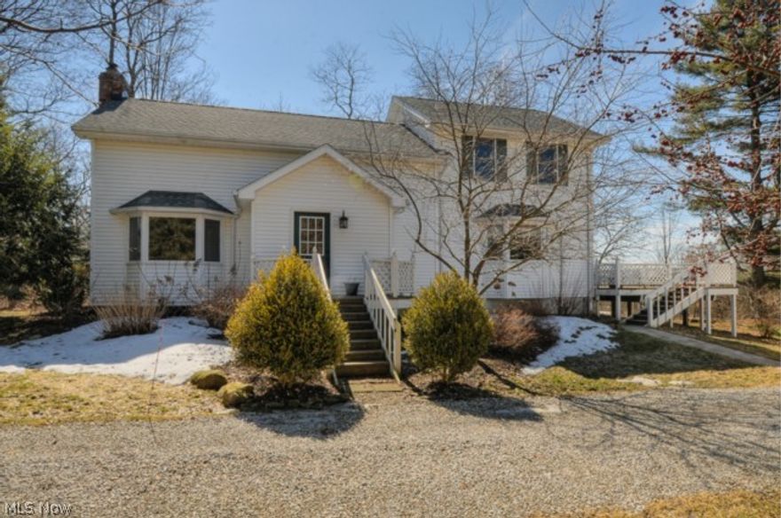 Charming updated Century Home on 2+ acres- Walk in to cozy Living Room featuring a brick fireplace w/heater insert, pine beams, bay window & hardwood floors- Open to formal dining room. Spacious eat-in kitchen w/bay window & sliding doors leading to a large custom deck- Upstairs features a generous master bedroom w/private bath & walk-in closet, two additional bedrooms & bath. The basement has a finished area for office or playroom- a special place for your family to call "Home".