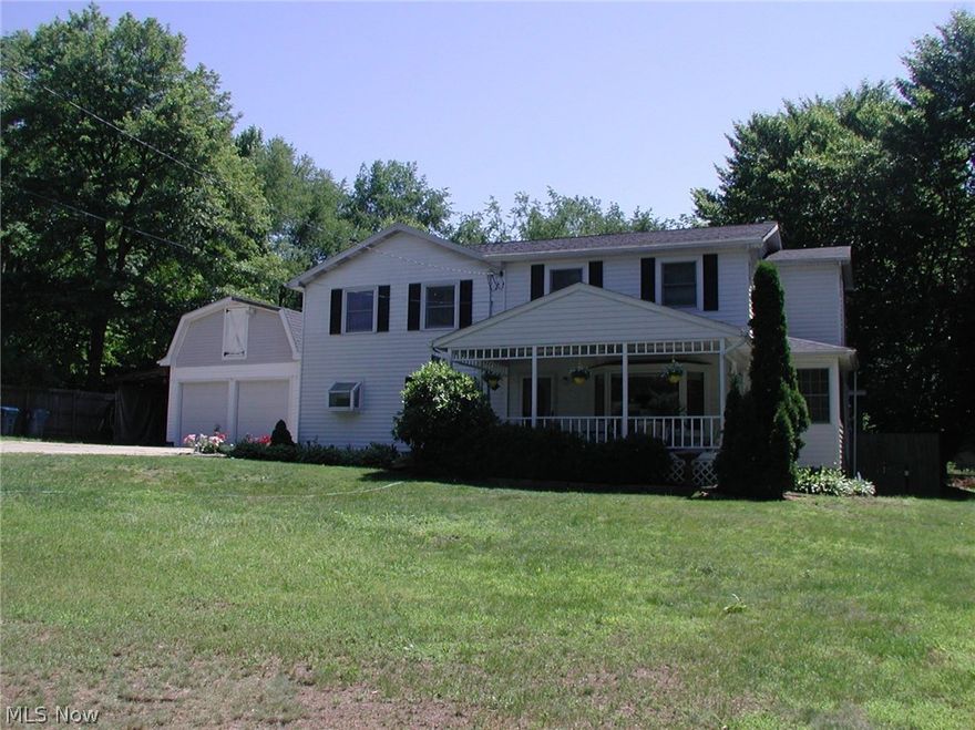 Beautiful 3 bedroom, 2 full bathroom Colonial on almost an acre in Munroe Falls. Spacious and charming front porch. Large formal living room opens to updated kitchen with bar and eating area. First floor family room with sliding doors to a deck overlooking partially fenced backyard. French doors off the living room open to an office with hardwood floors. Huge 2 car, detached, heated garage with a second floor storage and carport. First floor laundry, many ceiling fans and spacious basement. Come and appreciate this incredible home!