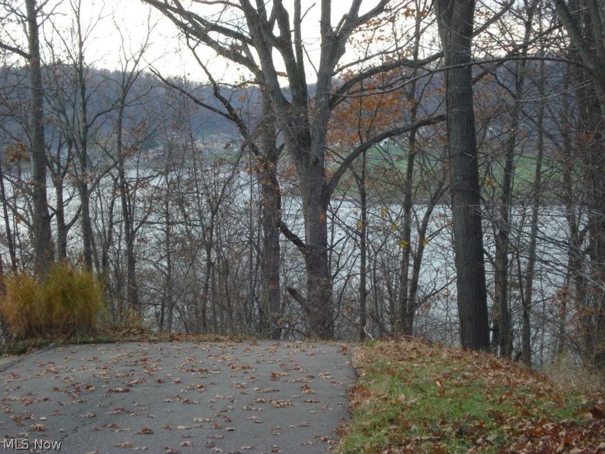 This oversized lot is situated on a point and has panoramic views of Lake Mohawk. Convenient to main beach, marina, golf course and front gate. Frontage on East Mohawk and also easily accessed from Yuma Trail where that would make ideal location for driveway. It's never too late to state enjoying lake living on a premier lake view lot.