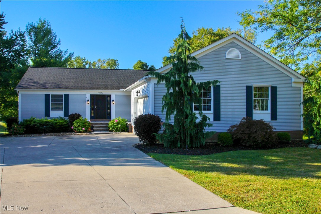 Over 4000 sq ft of finished living space in this impressive ranch in The Village of Westfield Center. This home is tucked on a scenic cul-de-sac lot with park-like views of a treed backyard and a neighboring lake with a fountain. Enjoy all the beauty without the upkeep. Step into a spacious foyer and discover thoughtful details at every turn. The step-down dining room features crown molding and opens to the vaulted great room, highlighted by a wall of windows and a cozy gas fireplace. The gourmet kitchen offers refinished hardwood floors, cherry cabinetry, granite counters, a breakfast bar, skylit dinette, and newer appliances. The popular split-bedroom layout includes a deluxe owner’s suite with deck access, built-ins, walk-in closets with organizers, and a spa-like bath with a jetted tub and separate shower. Two additional bedrooms a full bath, a half bath and a custom first-floor laundry with pantry, cabinets, and desk area complete the main level. The walkout lower level lives like its own home, featuring two bedrooms, a full bath, family room, full kitchen, brand new carpet, and abundant storage, perfect for multi-generational living or long-term guests. Outdoor living is just as inviting with a large upper deck and newer awning, a lower covered patio, and professionally updated landscaping, all with tranquil views. The oversized garage offers French doors to a 20x6 storage area, eliminating the need for a shed. Major updates include roof and skylights (2018), A/C (2019), hot water tank (2018), appliances (2017), main leve carpet (2017), lower level carpet (2025), hardwood floor refinishing (2021), deck awning (2019), landscaping (2020), and radon mitigation (2020). All in a desirable community near Westfield Country Club and Westfield Companies, this turnkey property is truly a rare find.