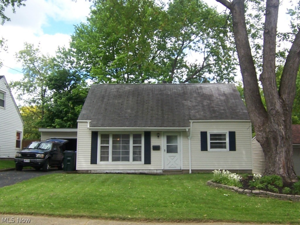 Surprise!! Move in read 3 or 4 Bedroom Cape, newer vinyl siding covered rear patio. Laminated hardwood look a like flooring.
Updated Bathroom, clean move in ready. Freshly painted interior. Fenced rear yard, attached garage.