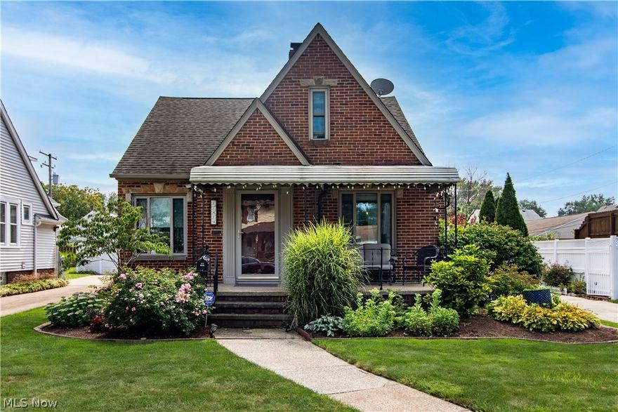 This classic 3 bedroom, 2 bathroom tudor style home has a great location, amazing curb appeal and functional upgrades to balance style and space. Besides the charming front porch, the home has a unique side porch that leads to the impressive kitchen featuring Amish built cabinets with hardware, durable cork flooring, built-in Wolfe gas stove with pot-filler and range hood, Bosch dishwasher, and a panelled Sub-Zero Refrigerator. A breakfast bar from the kitchen leads into the formal dining room. Family room is generous and has plenty of room for seating. A modern main bathroom has been updated with modern vanities, shower with glass doors and updated fixtures. The bedrooms are off the back of the home so they are separate from the main living areas for added privacy. One of the bedrooms has French Doors that lead to the backyard. Upstairs, a sprawling primary bedroom has 4 separate closets, attic access, and a nook that is perfect for a den, sitting room, nursery or storage area. Find more space in the finished basement that has a recreation room with a gas fireplace, bar, and kitchenette. Outdoors is another great place to entertain. The 3 tier deck, above ground pool, and bar are sure to impress. A 2.5 car garage is heated for added comfort and convenience. Come see today!
