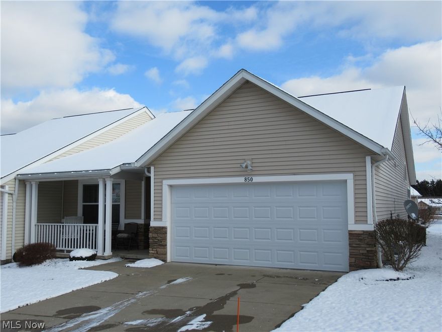 Welcome to this lovely ranch condo located in the heart of Lakemore.  This welcoming abode offers 2 bedrooms and 2 full baths.  This condo boasts a very open floor plan.  There is a large great room with vaulted ceilings and a corner fireplace.  There is a fully applianced kitchen with maple cabinetry.  There is wood flooring throughout the great room and kitchen.  Condo is an end unit.  Easy one floor living.   This home is awaiting a new owner.  Call to schedule a showing today!