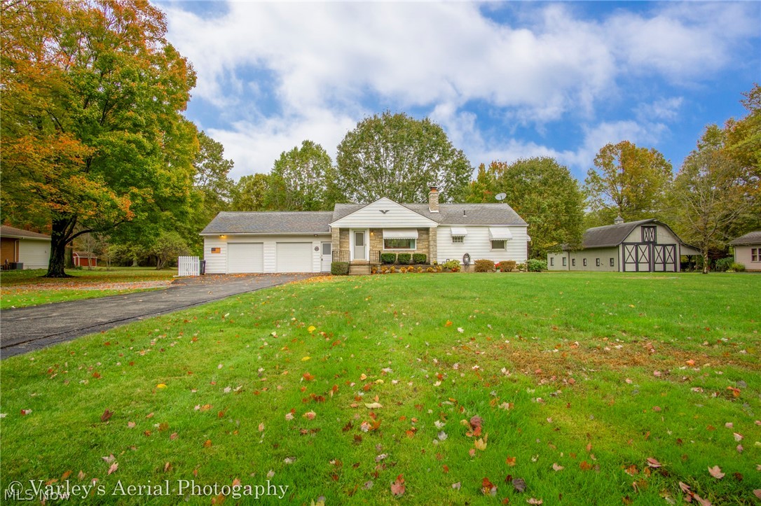Make it easy on yourself and just MOVE right into this BEAUTIFUL, freshly landscaped RANCH that sits on just under 2 acres! 1 floor living at its finest! When you walk into this home, you are greeted with a wonderful open concept floor plan! The kitchen is exactly what you've always dreamed of with plenty of updates such as WHITE cabinets, GRANITE counters, 2 sinks, stainless appliances and that wood-look ceramic tile throughout. The kitchen offers a large breakfast bar area open to the dining room with french doors that enters onto a great size two tiered deck and open to a large family room with a brick fireplace, built-ins on each side and recessed lighting throughout! Thermal pane vinyl windows throughout. 3 Bedrooms with 1 Full bath that has a whirlpool tiled tub and granite vanity. Basement has a transferrable waterproofing warranty , storage throughout and a walk out. WHOLE HOUSE GENERATOR. The attached two car garage has plenty of space and an area with its own access for addi
