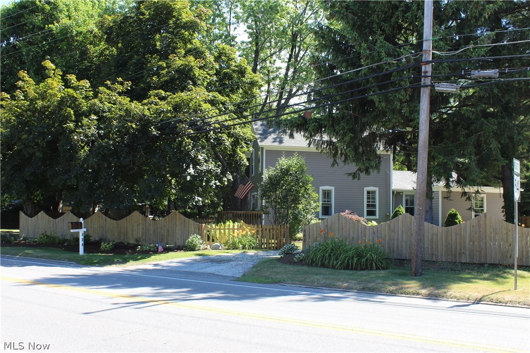 Tastefully Updated Century Home With All Of It's Original Charm! 3 Bedrooms and 1.50 Baths with an office/den that can be used as a 4th bedroom with it's own private bath. Large kitchen has a nice sized peninsula, updated counter tops, newer appliances, new back splash and fixtures, large pantry and tons of cupboard space. Original built-in desk and cabinetry, exposed brick chimney in the living room and upstairs bedroom. Freshly painted and newer flooring throughout yet the original hardwood floors remain. 2 bedrooms and a remodeled full bath upstairs. Partially finished basement for laundry and storage needs. Lovely, park-like yard offers newer landscaping and a paver patio. Newer fence in 2015, paver patio installed in 2014, furnace and sump updated in 2013. Home also includes a Radon gas detector. All appliance stay. Buyers are supplying an America’s Preferred Home Warranty for extra assurance. This home is ready for you to just pack your bags and move right in! Great location near