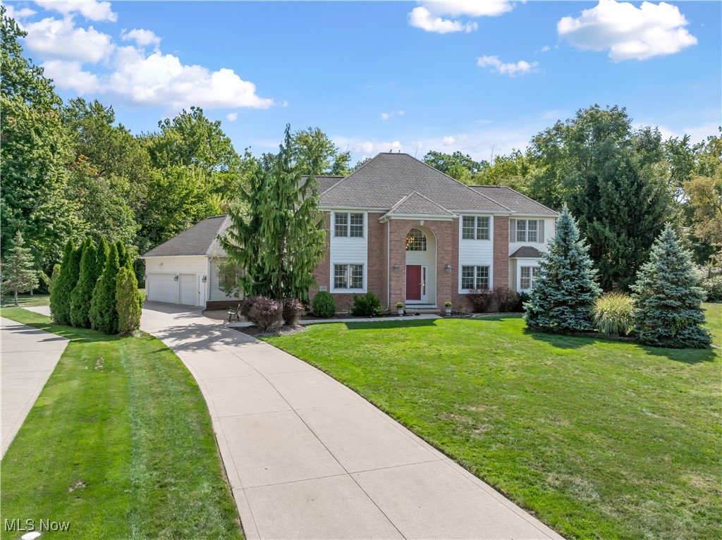 Welcome to this stunning custom built home located in the highly sought after Chairman's Cove development, within the desirable Mentor School District! Tucked away on a quiet cul-de-sac, this spacious home offers over 3,300 square feet of living space on a private .81-acre lot. Step inside and you’ll immediately appreciate the thoughtful layout and attention to detail throughout. The spacious eat-in kitchen is perfect for entertaining, featuring quartz countertops and plenty of room to cook and gather. It flows seamlessly into the elegant formal dining room for easy hosting. The inviting family room boasts vaulted ceilings and a wall of windows that fills the space with natural light, all centered around a beautiful custom fireplace. Just off the family room, you’ll find a first-floor office that could also serve as a bedroom, complete with access to the back yard deck — a great spot to relax or entertain. Upstairs, the generously sized bedrooms offer ample closet space for everyone. The luxurious owner’s suite is a true retreat, featuring a spa-like bathroom with double sinks, a Jacuzzi tub, and more custom touches. The lower level is already plumbed for a full bathroom and offers great potential to finish into additional living space. You’ll love the privacy of the backyard, perfect for quiet evenings or outdoor gatherings. For your convenience, all appliances will remain. Plus, you're just minutes away from shopping, dining, and everyday essentials. Don't miss your chance to own this beautifully maintained home in a prime location!