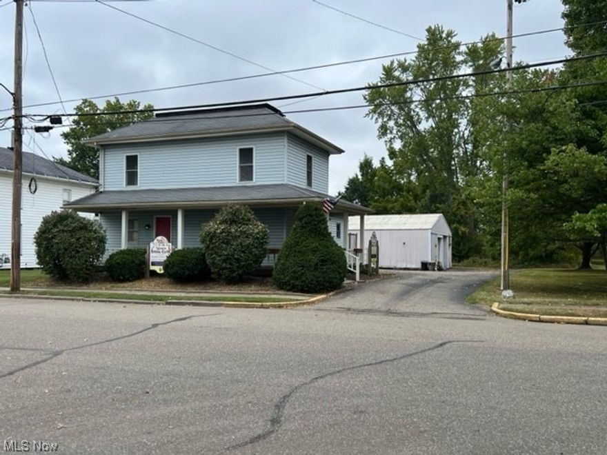 Originally a residence but was used as a Vet/ Medical office, multi uses is zoned commercial but could be converted and zoning changed to residential.  
Tons of possibilities and potential.  Walking distance to town, shops etc.  Large Pole Building for extra storage/ garage with large overhead door.