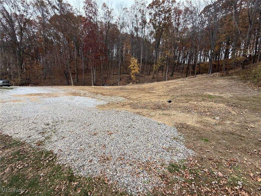 Cleared city lot ready for your vision! This property features a 12x32 garage with electricity, offering immediate utility and storage. 70 ton of gravel and drainage culvert constructed earlier this year for improved site preparation. Located at the end of a quiet dead-end street, the lot backs up to a forested area, providing natural privacy and a peaceful setting. The Village currently reserves an alley easement along the rear and left side of the lot, with expressed willingness to vacate, creating additional opportunity for future use. Manufactured homes are permitted, provided they are placed on a basement or permanent foundation. Convenient location within the Village of Dennison. Buyer to complete their own due diligence with the Village regarding zoning, utilities, and building requirements. The lot overlooks the historic, beautiful Thornwood Park neighborhood of Dennison.