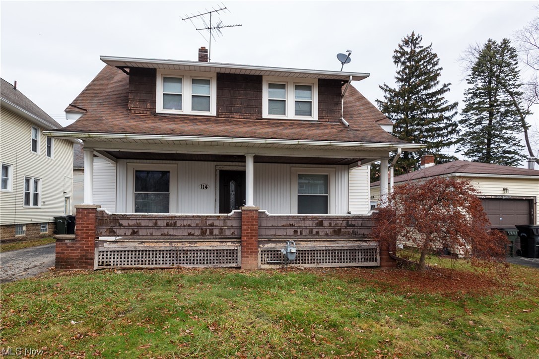 This home, built in 1928, is waiting for you to restore its beauty. Walk up the steps to the front porch with mahogany ceiling boards in perfect condition. Walk into the foyer from the new front door, hang up your coats, and walk through the original wood French doors with glass panels. The home has original hardwood floors throughout with the original trim, and the staircase to the second floor is impressive. At the top of the stairs is an inviting window seat with storage. The living room has carpet, an ornamental fireplace, and three windows letting in the natural light. The dining room offers a large picture window and two additional windows with hardwood floors and more original wood trim. The kitchen is spacious and waiting for your updates. It includes additional space for a table or a mud room for the kids’ things. Three spacious bedrooms on the second floor and an updated full bath need your finishing touches. The basement has enough space to add a rec room and has a separate utility room and laundry room: newer vinyl windows, a new front door, and new siding. The home is being sold as is.