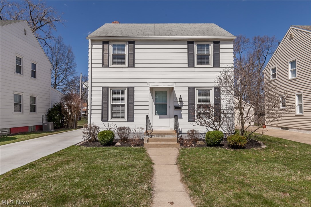 You'll fall in love with this updated move-in ready two-story home on a quiet street with tons of natural light. The kitchen has been completely renovated (2015) and includes white Kraftmaid slow-close cabinets, quartz countertops, mosaic backsplash, porcelain tile, and newer appliances. Refinished hardwood floors (2019) and crown molding in the dining room and living area creates a beautiful entertaining space. On the second floor, you'll find three bedrooms and a remodeled bathroom (2019). The waterproofed finished basement includes a large rec space, oversized closets, remodeled laundry room, and beautiful half bath. The utility room with epoxy floors is private from the rest of the living space and offers plenty of storage space. Enjoy the lush backyard on the new concrete patio, next to the detached 1.5 car garage and new concrete driveway. Other updates include the electrical, fans in two bedrooms, hot water tank, fixtures, and fresh paint. Although the street is quiet, you're ju