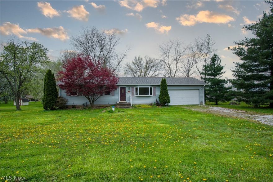 New roof 2021! Ranch-style home in Nimishillen Township. Enjoy this large lot, just under an acre, at the end of the road on Apple Street! This lovely home offers two parcels, three bedrooms, one bath, a nice-sized living room with a bayed window, a dining area with sliders/walk-out to the deck, and a large backyard with a shed. The 3rd bedroom is currently a convenient first-floor laundry room but could easily be changed back into a bedroom. An eat-in kitchen with Stainless steel stove, breakfast bar, and access to & from the oversized two-car garage. The lower level has tons of potential for additional living space. Updates include new Carpet and Laminate flooring (2022), a new Well, Fresh paint, and moved laundry upstairs (2021). Close to everything and approx. 1 mile to Rt. 62! Make an appointment for your private showing today!