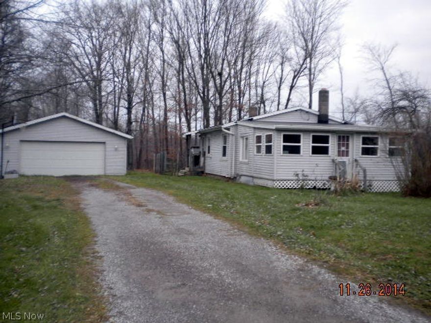 1 acre wooded lot with city water, 2 car garage. Nice starter home needs buyers own TLC. Great location, not a drive by. Great investment property