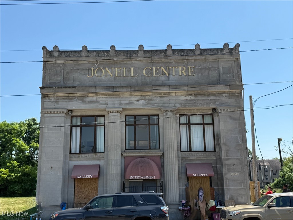Incredible development opportunity, the historic Jonell Centre, a landmark building in the City of Cleveland which was formerly used as a bank (Ameritrust) and a remarkable party center, right next door to where the Gold Coast Lofts are going in on E 105th/Superior (a fabulous mixed use project featuring retail, offices, and residences), just a couple blocks from the VA hospital, Wade Park, and University Circle. The French-design-inspired Beaux Arts Architecture interior is reminiscent of the Old Arcade downtown, with a massive skylight and a 2000+ sq ft Mezzanine level divided into small shops or offices. The first floor is comprised of various spaces, including a huge hall/lobby and additional partitioned spaces for more offices, retail, etc. The full basement includes a kitchen area complete with hood and other equipment. The rear of the building could be opened back up with an overhead door with direct access to a warehouse space. Other features: marble trim, chandeliers, 4 bank vaults. Includes the lot next door for a total of .18 acres, plus some additional parking possible at the rear. Temporary power pole already set by Cleveland Public Power. Includes the lot to the east. Restore this beautiful "lady" to its former glory!