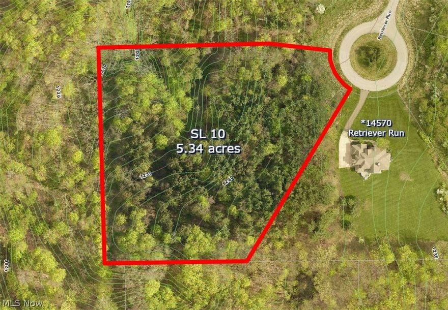 Build your dream house among the pines on this quiet 5.34 acre cul-de-sac lot with beautiful ravine in Russell Twp. Walk-out basement potential.  Located in the Heather Hollow Subdivision off Pekin Rd minutes from Chagrin Falls and Chesterland.   West Geauga School District. 1.9 miles east of 306. Choose your own builder.