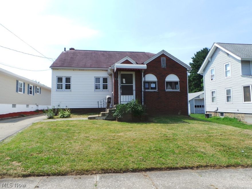 Cute frame and brick bungalow home featuring and updated kitchen and good floor plan of 3/4 bedrooms.  There is a nice two car garage for excellent storage.  Property is sold AS IS.  Equal Housing Opportunity.  FHA uninsurable.